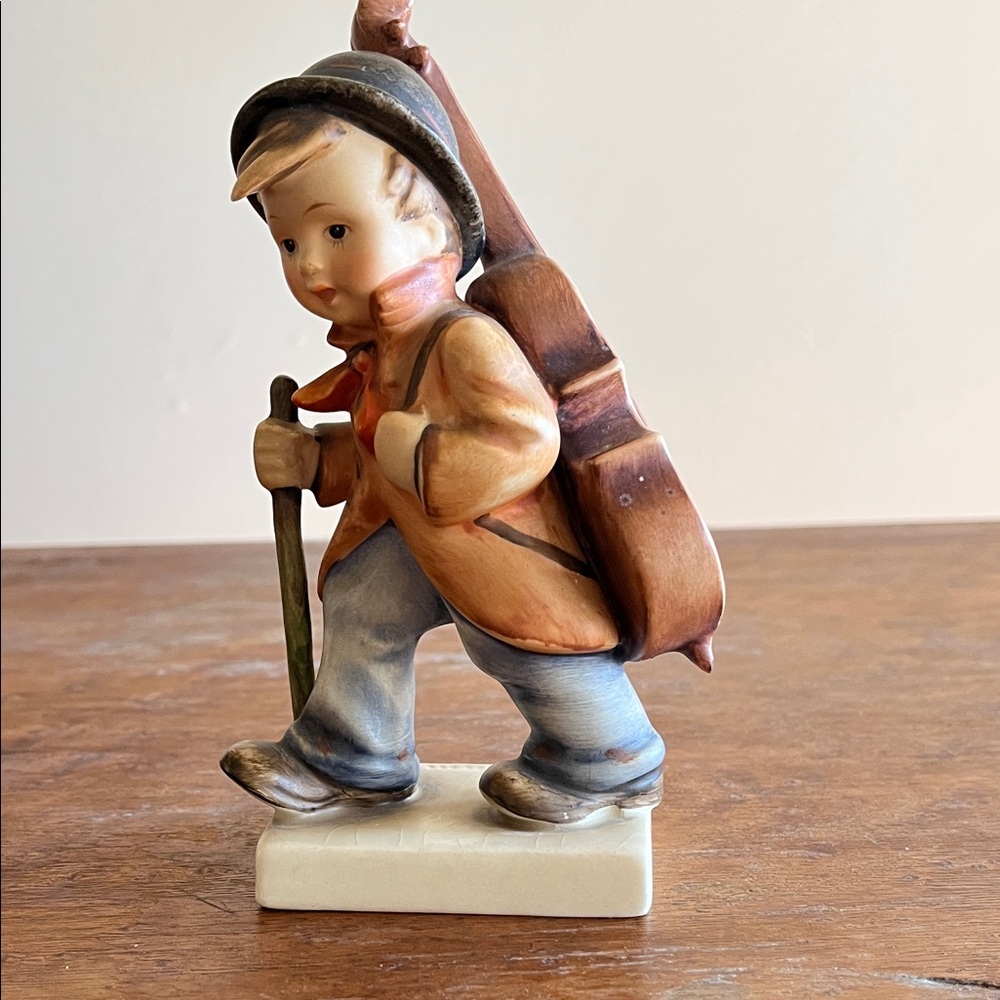 Vintage Boy Figurine with Orange and Blue Details